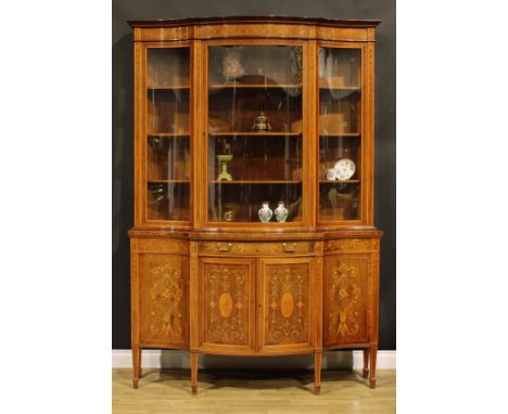 An Edwardian Sheraton Revival satinwood and rosewood banded mahogany and marquetry shaped serpentine vitrine, by Edwards &amp