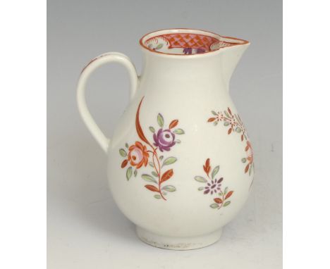 A Worcester sparrow beak jug, decorated in Chinese export style with flowers, the interior with scale pink border and flowers