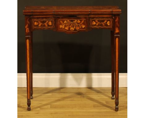 An early 19th century Dutch marquetry games table, hinged top enclosing a parquetry field inlaid for chess, flanked to the an