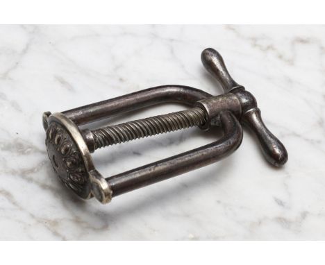 Nutcrackers - a 19th century silver plated screw-action nut cracker, stirrup shaped frame, the oval base with egg-and-dart bo