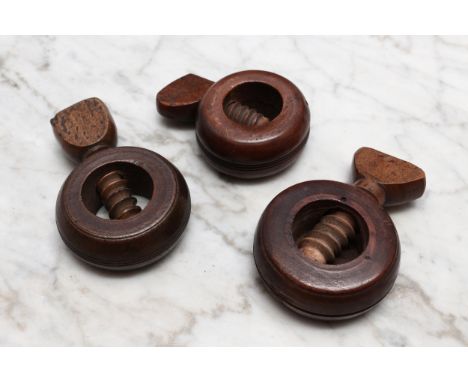 Nutcrackers - a 19th century ring shaped screw-action pocket nut cracker, 5cm diam; others, similar (3) 