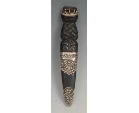 A Scottish silver mounted sgian dubh dagger, 8cm blade, the hilt and scabbard fittings carved and chased with thistles, 18cm 