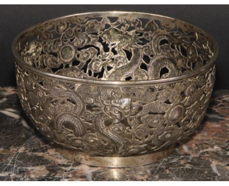 A Chinese silver bowl, pierced and chased with dragons amongst scrolling clouds, 11cm diameter, Ing Wo, Hong Kong, 161g, c.19
