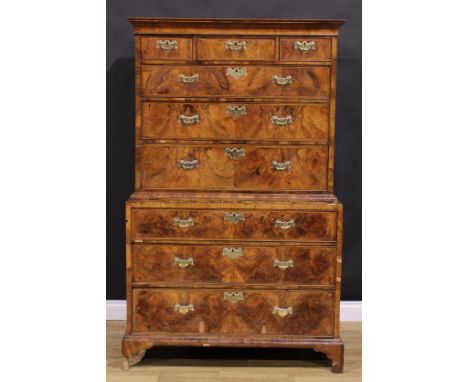 A George II walnut chest on chest, concave moulded cornice above three short and three long graduated drawers, the base with 