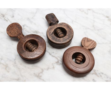 Nutcrackers - a 19th century ring shaped screw-action pocket nut cracker, 5.5cm diam; others, similar (3) 