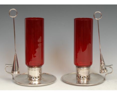 A pair of late Victorian E.P.N.S and ruby glass storm lantern chambersticks, tall cylindrical shades, dished circular bases, 