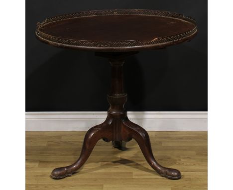 A George III mahogany birdcage tripod silver table, one-piece circular top with fretwork gallery pierced in the Chinese Chipp