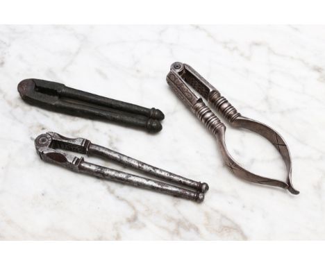 Nutcrackers - a 17th/early 18th century steel lever-action nut cracker, knop terminals, 10cm long, c.1700; another, similar, 