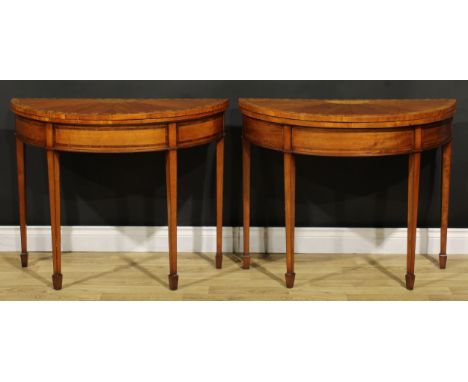 A near pair of Sheraton Revival satinwood and marquetry demilune card tables, each with a hinged top with segmented radiating