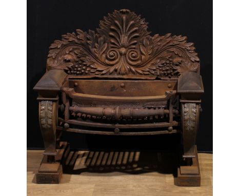 A 19th century cast iron country house bowfront fire grate, lyre shaped end supports applied with lion masks and acanthus, 91