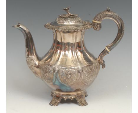 An early Victorian silver teapot, chased in the Rococo Revival taste, flower finial, anthemion feet, 22cm high, Richard Pierc