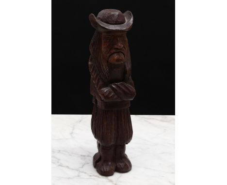 Nutcrackers - an early 20th century French standing lever-action nut cracker, as a Breton peasant, 20cm long 