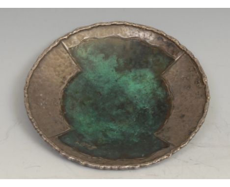 A French Modernist silver and enamel circular dish, decorated in tones of verdigris on a planished ground, 11.5cm diam, Loys,