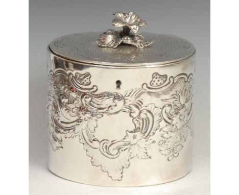 A George III silver oval tea caddy, chased in the Rocco taste, hinged cover with flower finial, 12cm wide, Charles Aldridge &