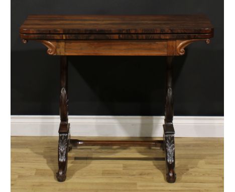 An unusual 19th century rosewood and mahogany card table, hinged top enclosing a baize lined playing surface, lyre-shaped sup