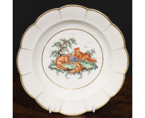 A Worcester Aesop Fable shaped circular plate, painted in polychrome with foxes, osier border, gilt dentil rim, 20.5cm diam, 