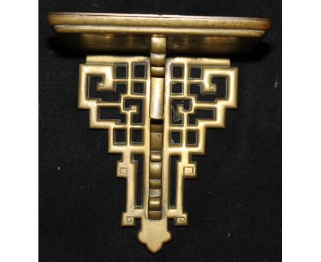 A Chippendale Revival brass wall bracket, pierced with scrolls in the Chinese taste, 22cm high, early 20th century 