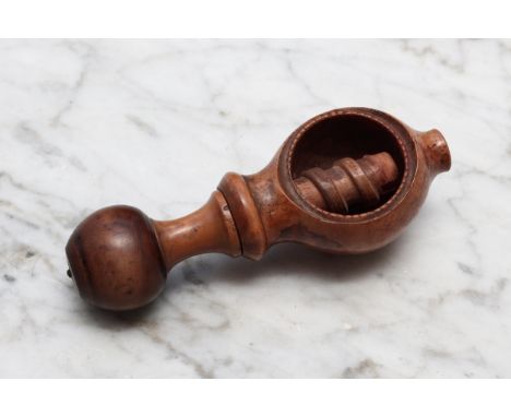 Nutcrackers - an early 19th century boxwood screw-action pocket nut cracker, globular pommel, 10cm long, c.1840 
