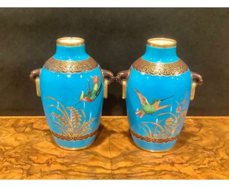A pair of Mintons Aesthetic Movement two-handled Chinoiserie vases, in the manner of Christopher Dresser, of inverse baluster