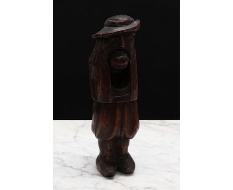 Nutcrackers - an early 20th century French standing lever-action nut cracker, as a Breton peasant, 21cm long 