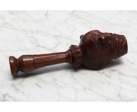 Nutcrackers - a Black Forest novelty screw-action nut cracker, double sided, carved as a comical janus faced man, smiling and