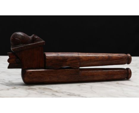 Nutcrackers - an oak lever-action nut cracker, carved with a mouse in the manner of Robert Thompson, Mouseman of Kilburn, 21c