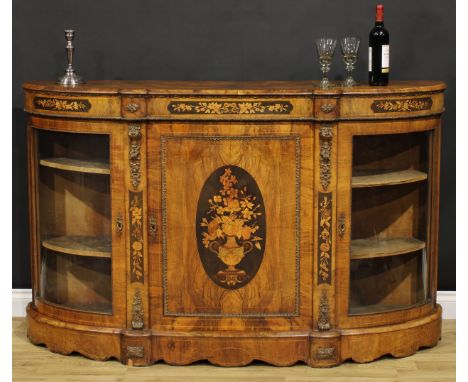 A Victorian gilt metal mounted walnut and marquetry credenza, slightly oversailing top above a panel door inlaid with a flowe