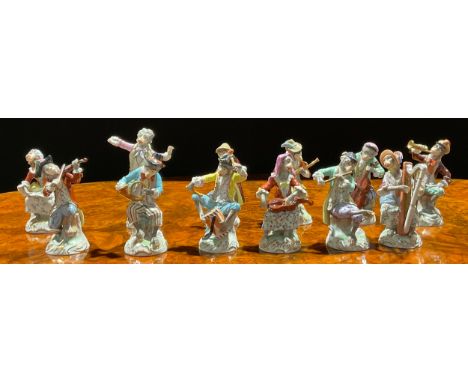 A Dresden twelve-piece monkey band, after the Meissen originals, in animated poses, playing various instruments, decorated in