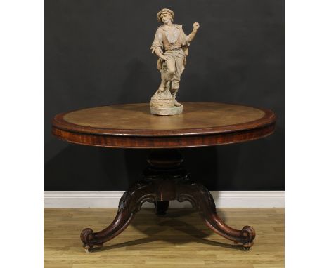 A Victorian mahogany room centre library table, circular top with inset tooled leather writing surface, turned column, egg-an