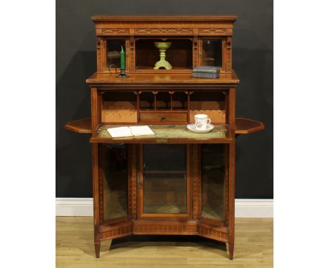 A late Victorian Aesthetic Movement satinwood banded walnut and mahogany chamber cabinet, the superstructure with a pair of b