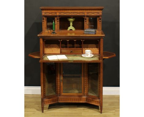 A late Victorian Aesthetic Movement satinwood banded walnut and mahogany chamber cabinet, the superstructure with a pair of b