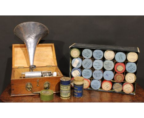 An early 20th century cylinder phonograph, rectangular case, aluminium horn, 32cm wide; a selection of cylinders, boxed 