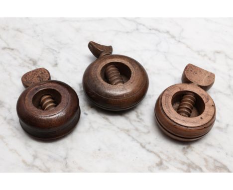Nutcrackers - a 19th century ring shaped screw-action pocket nut cracker, 6cm diam; others, similar (3) 