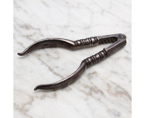 Nutcrackers - a George V silver lever-action nut cracker, in early 18th century style, 10.5cm long, Birmingham 1911 