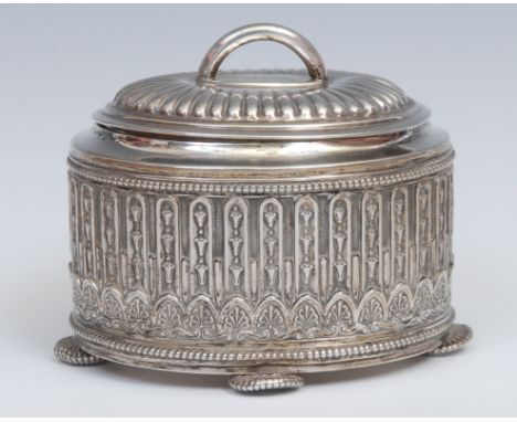 A German silver oval tea caddy, hinged fluted cover, the side chased with a repetitive border of bell husks and anthemion, wi