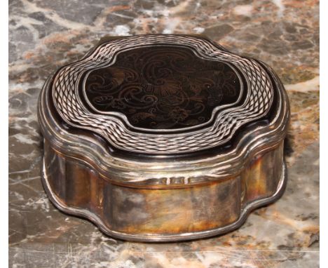 An 18th century silver coloured metal and tortoiseshell quatrefoil snuff box, hinged cover inlaid with rococo scrolls, within