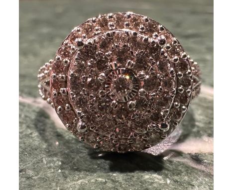 A contemporary diamond cluster ring, multi level target crest set with forty eight round brilliant cut diamonds, above v shou