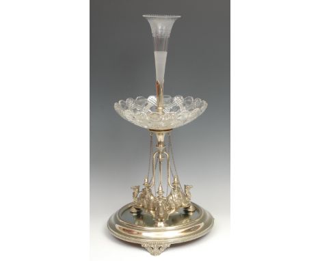 A Victorian E.P.N.S table centre epergne, in the Orientalist taste, central trumpet shaped flute above a pressed glass dish, 