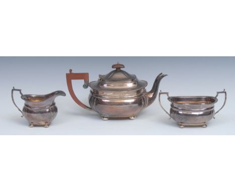 A George V silver three piece boat shaped tea service, gadrooned borders, bun feet,  Birmingham 1933/1934, 26oz 