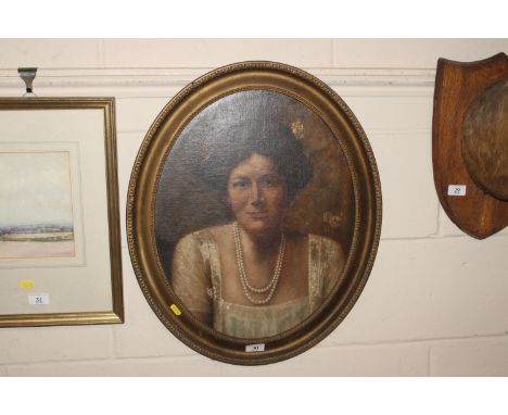 An oval gilt framed oil portrait study of a female