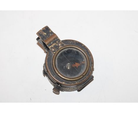 A military marked compass, mark to the reverse J. M. Glauser London, dated 1940