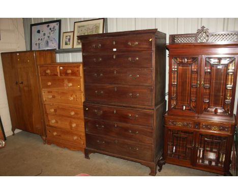 A 19th Century mahogany chest on chest, upper section fitted four graduated drawers, lower section fitted three drawers, rais