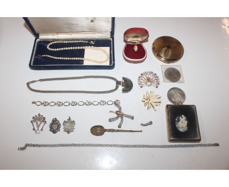 A box of various jewellery to include two silver fobs; filigree work brooch; various other brooches; coins; a 9ct gold and si