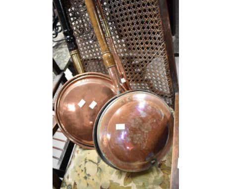 Two vintage warming pans and a copper horn