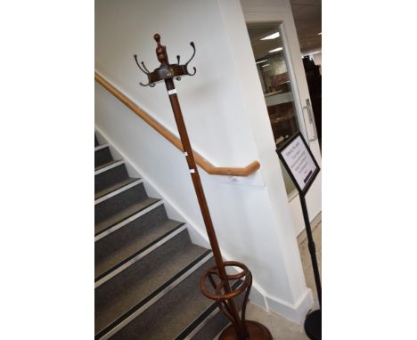An Oriental hardwood hat stand , having turned finial and bentwood supports, on platform base, height approx. 180cm