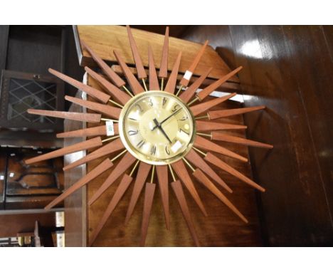 A vintage 'starburst' clock, dial named for Ainstey and Wilson
