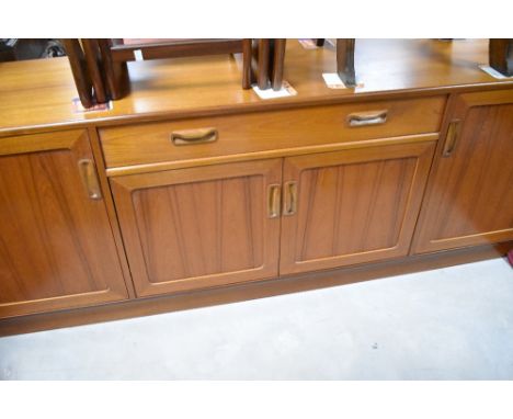 A vintage teak sideboard, of stylised form, possibly G plan Fresco, width approx 185cm