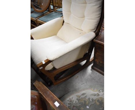 A vintage teak framed designer rocking chair, in the 'paper knife' style,  attributed to Kai Kristiansen/Magnus Olesen - sold