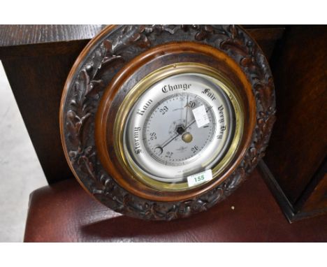 A vintage Smiths Shortland aneroid barometer having carved foliate surround, diameter approx. 31cm
