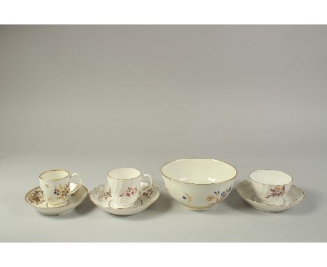 A WORCESTER BOWL, painted with dry blue and gilt flowers, a tea bowl, coffee cup and two saucers, all shanked and painted wit